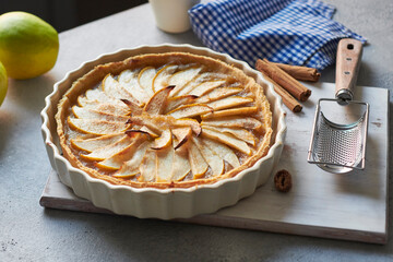 French apple pie on kitchen counter freshly baked delicious apple pie.
