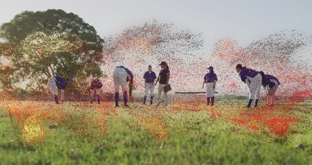 After coach pointing, baseball team stretching as ember swirl weaving around for pregame warm-up - Powered by Adobe