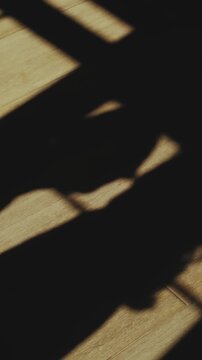 Shadows on the floor of a couple in love kissing. Silhouette of a romantic couple in love in the sun. Unrecognizable people. Concept of relationships and eternal love.