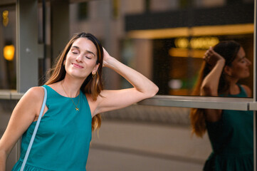 Happy businesswoman relaxing with eyes closed in urban setting