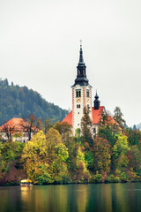 The magical atmosphere of Lake Bled in autumn. Among boats and mystical charm. Slovenia