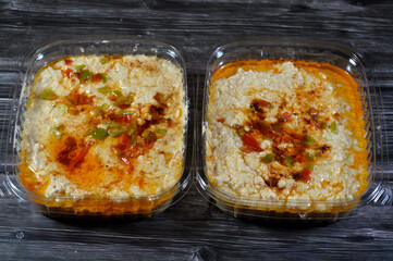 Turkish Mish Cheese, layering Areesh cheese with salt in an earthenware jar, adding a pickling solution of buttermilk, sour skim milk, whey, and peppers, Then prepared with paprika, oil and pepper