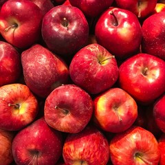 Red apples pile, closeup with top view, Red apple patterns, Top view of bright ripe fragrant red apples with water drops as background