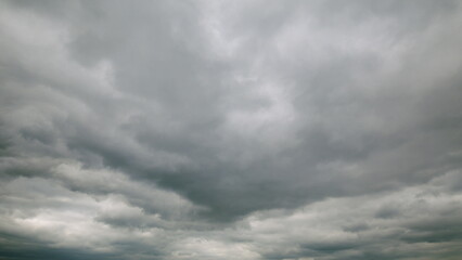 The Dramatic Overcast Sky featuring a multitude of Clouds evokes a powerful feeling of awe,