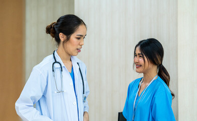 Fototapeta premium Healthcare and medical services. Doctors and nurse at hospital office working with another doctor.