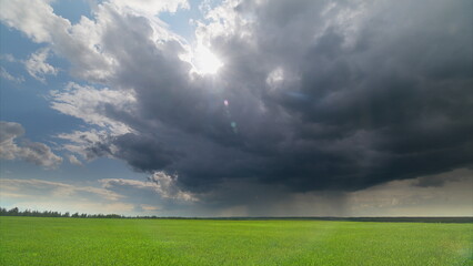 Dramatic Skies Filled with Clouds Hovering Over a Lush and Expansive Green Field