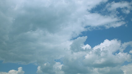 Experience vibrant cloud patterns in a bright blue sky on this clear, inviting day