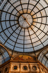 Italy, Europe: architectural details of The Galleria Vittorio Emanuele II, Italy's oldest active shopping gallery, one of the city symbols built between 1865 and 1877. Iron dome and arcade