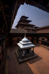 Old courtyard of Patan Durbar Palace as a peaceful place in Kathmandu, Nepal.
