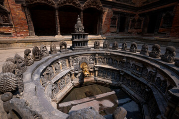 Old courtyard of Patan Durbar Palace as a peaceful place in Kathmandu, Nepal.