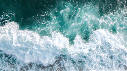 Obraz premium Aerial view of a turquoise coastline with abstract wave patterns and blue tones