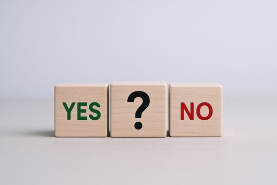 Decision Making Concept: Wooden Blocks Displaying Yes, No, and Question Mark on Neutral Background