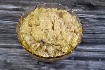 Egyptian fava beans with linseed flaxseed or flax oil, the main dish, sandwich in the breakfast in Egypt, cooked with crushed bean, yellow lentils and wheat, Fava beans main dish of Suhor in Ramadan