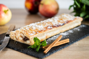 Homemade apple strudel on wooden table