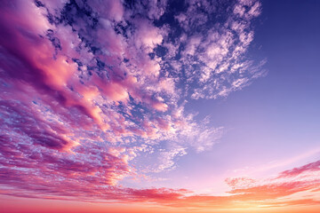 Beautiful sunset sky with vibrant orange and pink hues, showcasing stunning array of clouds and colors that evoke sense of tranquility