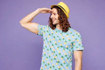 Young happy explorer man wear blue beach t-shirt yellow hat rest near hotel pool hold hand at...