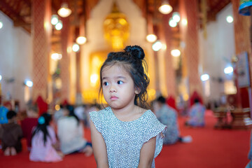 Adorable kid girl enjoy travel in buddhist temple gold theme pagoda