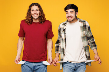 Young sad two friends buddies men they wearing casual clothes together look camera show empty...