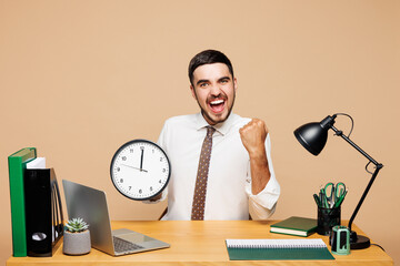 Young happy successful employee business man he wear white shirt tie sit work at office desk with...