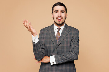 Young minded shocked confused employee business man corporate lawyer wear classic formal grey suit...