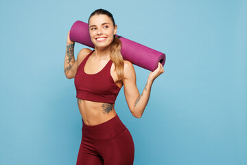 Young happy fitness trainer instructor sporty woman sportsman wear red sportswear training in home...