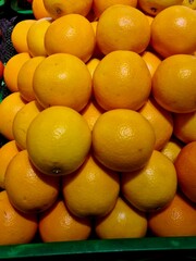 Fresh oranges stacked in a pile