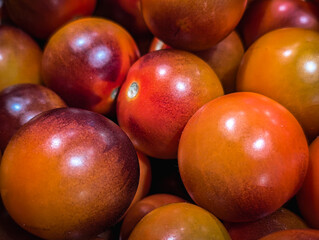 fresh kumato brown tomatoes close up