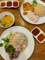 Hainanese chicken rice with soup and dipping sauce .Street food in Thailand