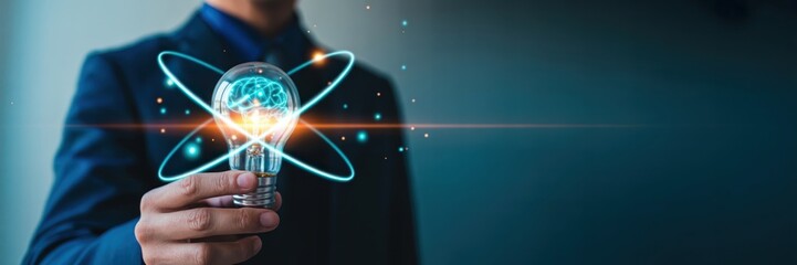Business Innovation - A man holding a glowing lightbulb with an abstract brain and orbits, symbolizing a new idea, innovation, and creative thinking