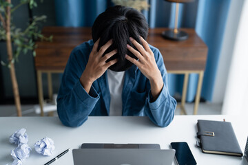 Stressed Man Struggling to Generate Ideas in Office