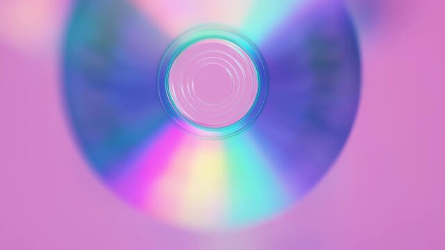 Holographic CD with Rainbow Reflections on Pink Background
