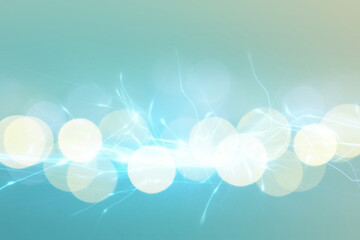 Abstract background of light blue shades with glare and bokeh effect.