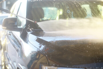 Self-service express car wash. Outdoor high pressure washing for cars.