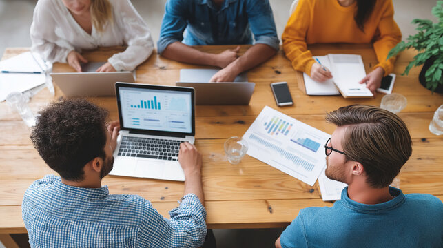 Diverse Team Analyzing Business Statistics and Marketing Plans