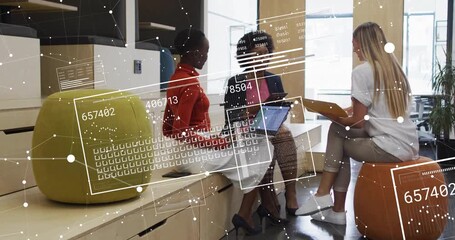 Three colleagues typing on business laptop initiating data overlays updating over folder for review - Powered by Adobe