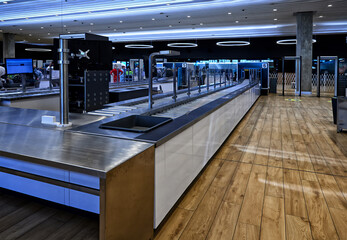 Stainless steel airport security conveyor system with electronic display, lighting. Used for...