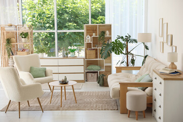 Stylish sofa and other furniture in living room. Interior design