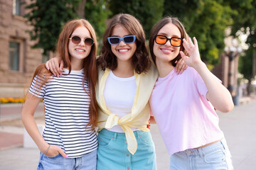Portrait of happy friends in sunglasses outdoors