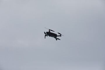 Copter in flight. Drone against the sky.