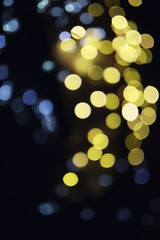 Abstract bokeh background. Golden bokeh circles on dark blue background. Layer overlay.