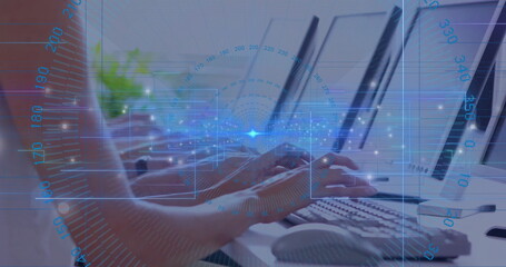 Typing hands pressing keys on white keyboard in office workspace, with HUD graphics and monitors