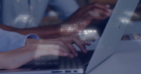 Typing professional hands entering data on laptops in modern office, with glowing digital overlay