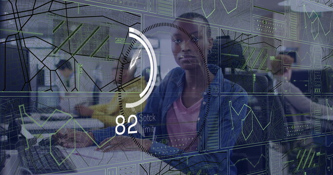 Woman in denim shirt analyzing holographic screens in control center, gauge showing 82 stock limit