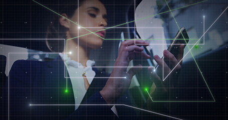 Holding smartphone with stylus pen, woman in dark blazer using digital network overlay in office