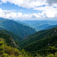 Naklejka premium Mountainous landscape with valleys and clouds