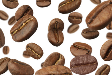 Roasted coffee beans falling against white background