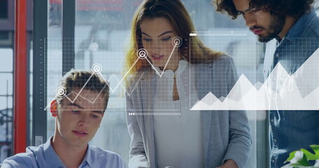 Collaborating professionals analyzing data around office desk, chart overlay with graphs and plant