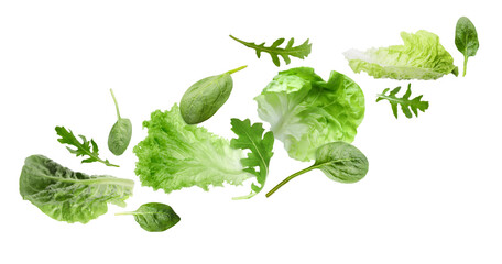 Fresh salad leaves flying against white background. Lettuce, spinach and arugula