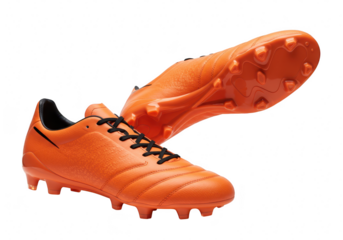 Pair of orange soccer cleats isolated on transparent background