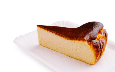 Delicious creamy cheesecake served on a white plate in a bright setting